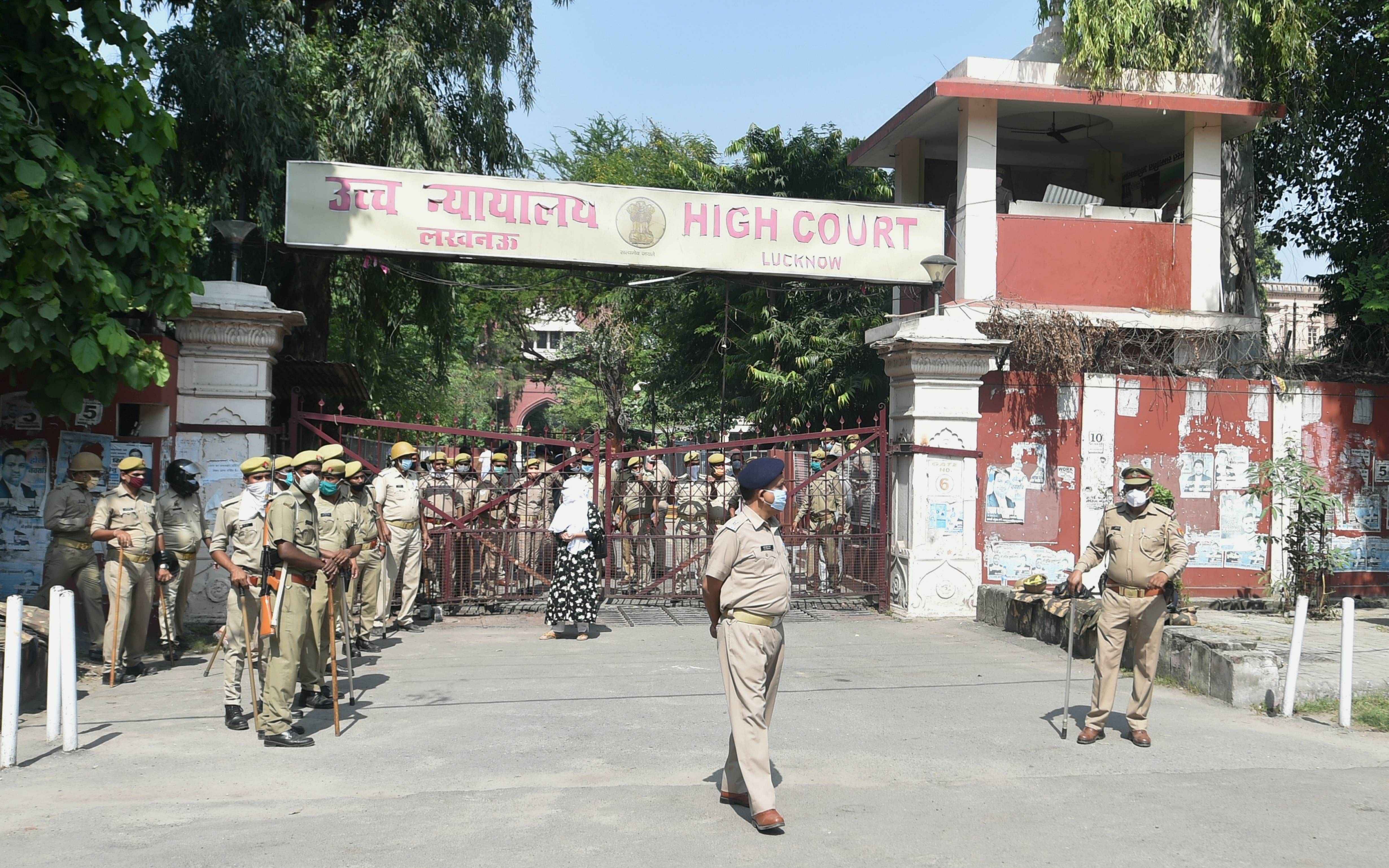 Police stand guard outside a special CBI court during pronouncement of its judgement of those accused in 1992 Babri mosque demolition case. Credits: PTI Photo