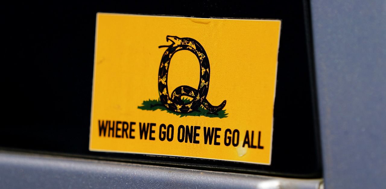 A sticker that references the QAnon slogan is seen on a truck. Credit: Reuters Photo