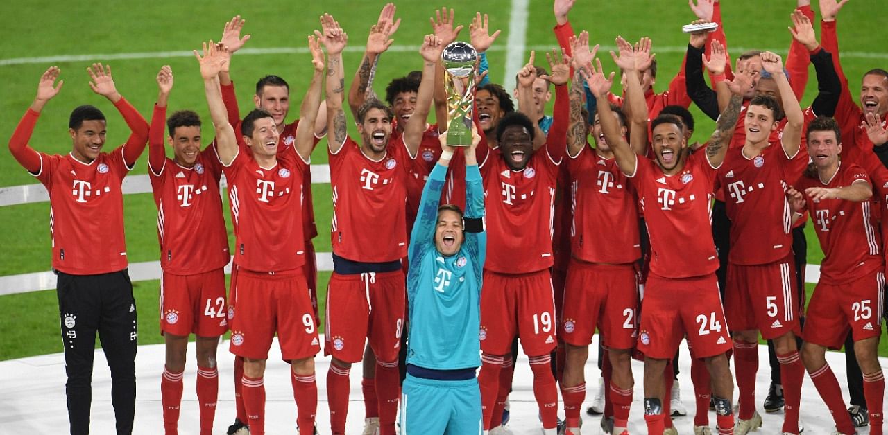 Players of Bayern Munich with goalkeeper and captain Manuel Neuer. Credit: AP Photo