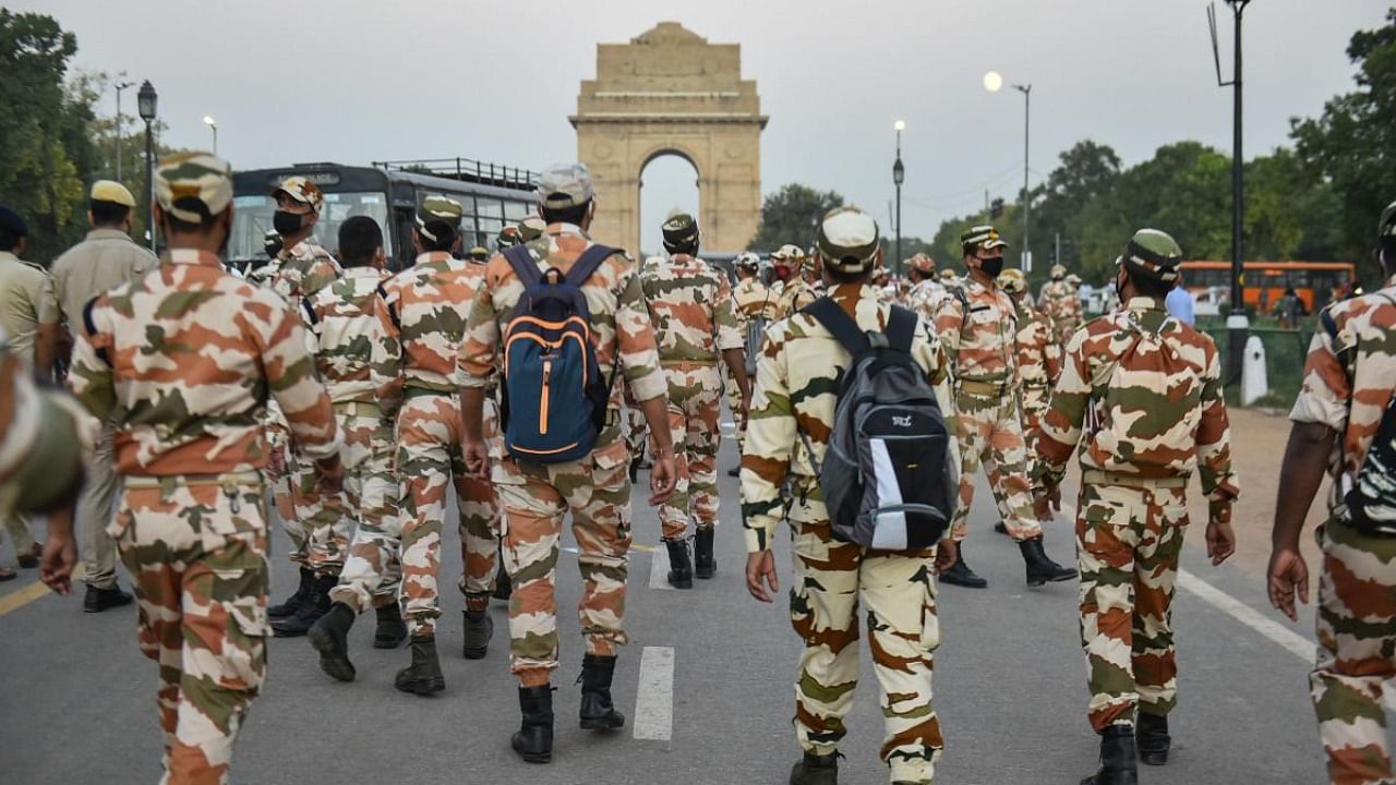 Police stand guard at India Gate during a protest against the death of a Dalit woman who was gang-raped in Hathras (UP), in New Delhi. Credit: PTI.