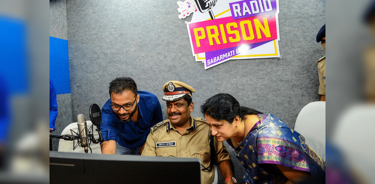 Additional Director General of Police and Inspector General (Prisons) of Gujarat Police, KLN Rao (C), and his wife (R) attend the launch of 'Radio Prison' at Sabarmati Central Jail in Ahmedabad on October 2, 2020. Credit: AFP Photo