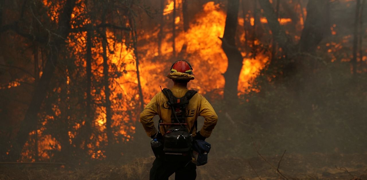 A Cal Fire firefighter monitors a firing operation while battling the Glass Fire in Calistoga. Credit: Reuters Photo