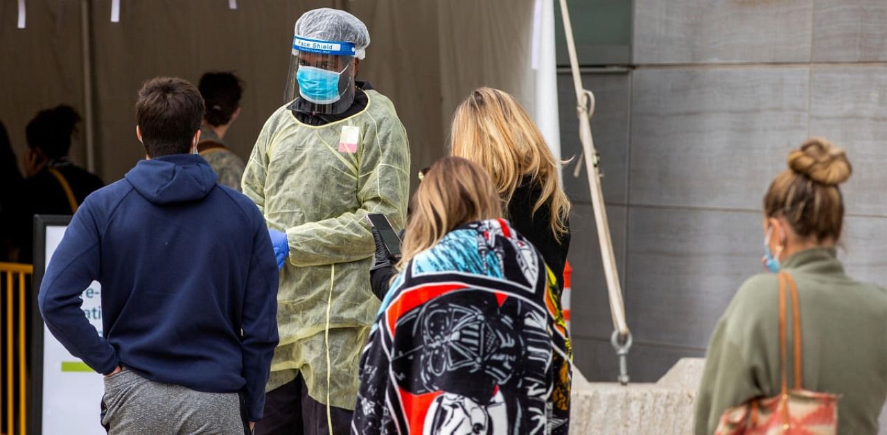 People wait in line at the Women's College coronavirus disease testing facility in Toronto, Ontario, Canada. Credit: Reuters