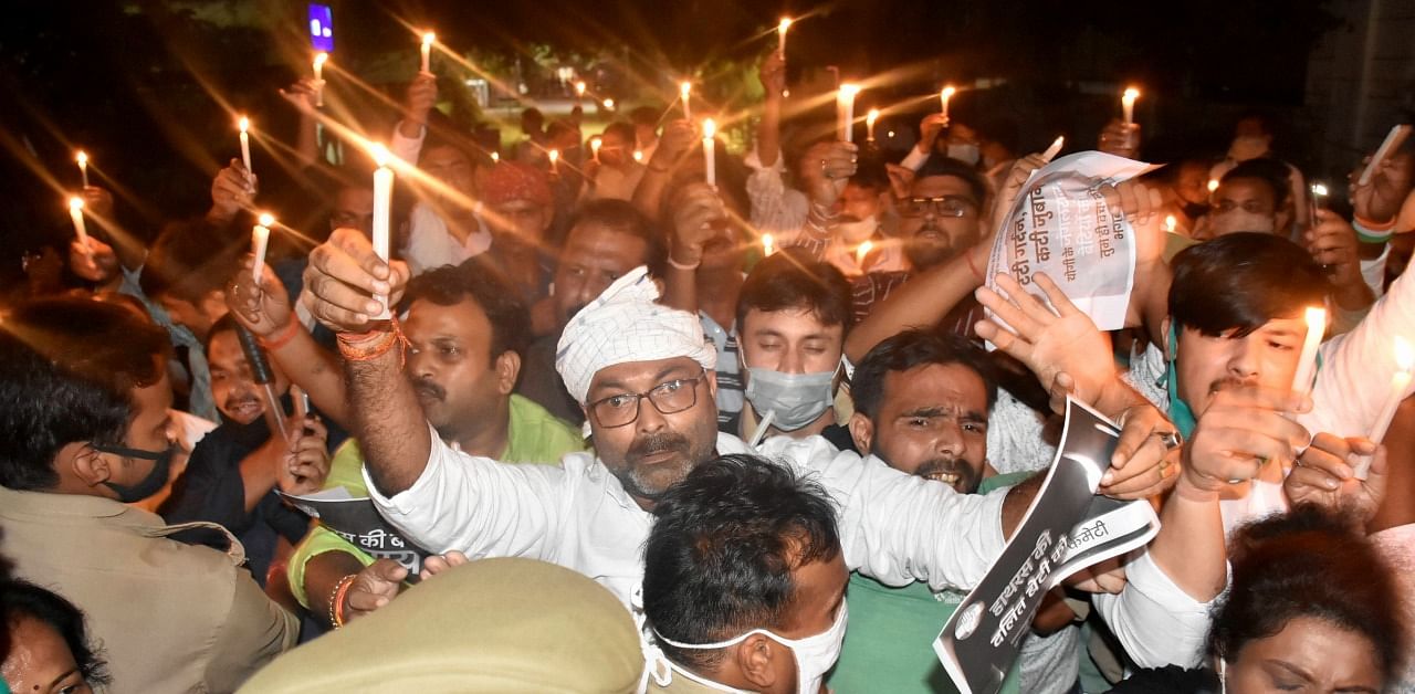 UPCC President Ajay Kumar Lallu takes part in a candlelight protest march over the death of the Dalit woman from Uttar Pradesh's Hathras. Credit: PTI Photo