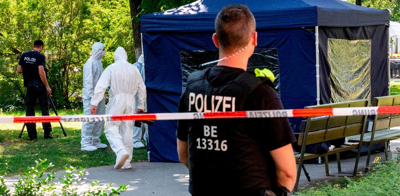 Forensic experts of the police securing evidences at the site of a crime scene in a park of Berlin's Moabit district, where a man of Georgian origin was shot dead. Credit: AFP Photo