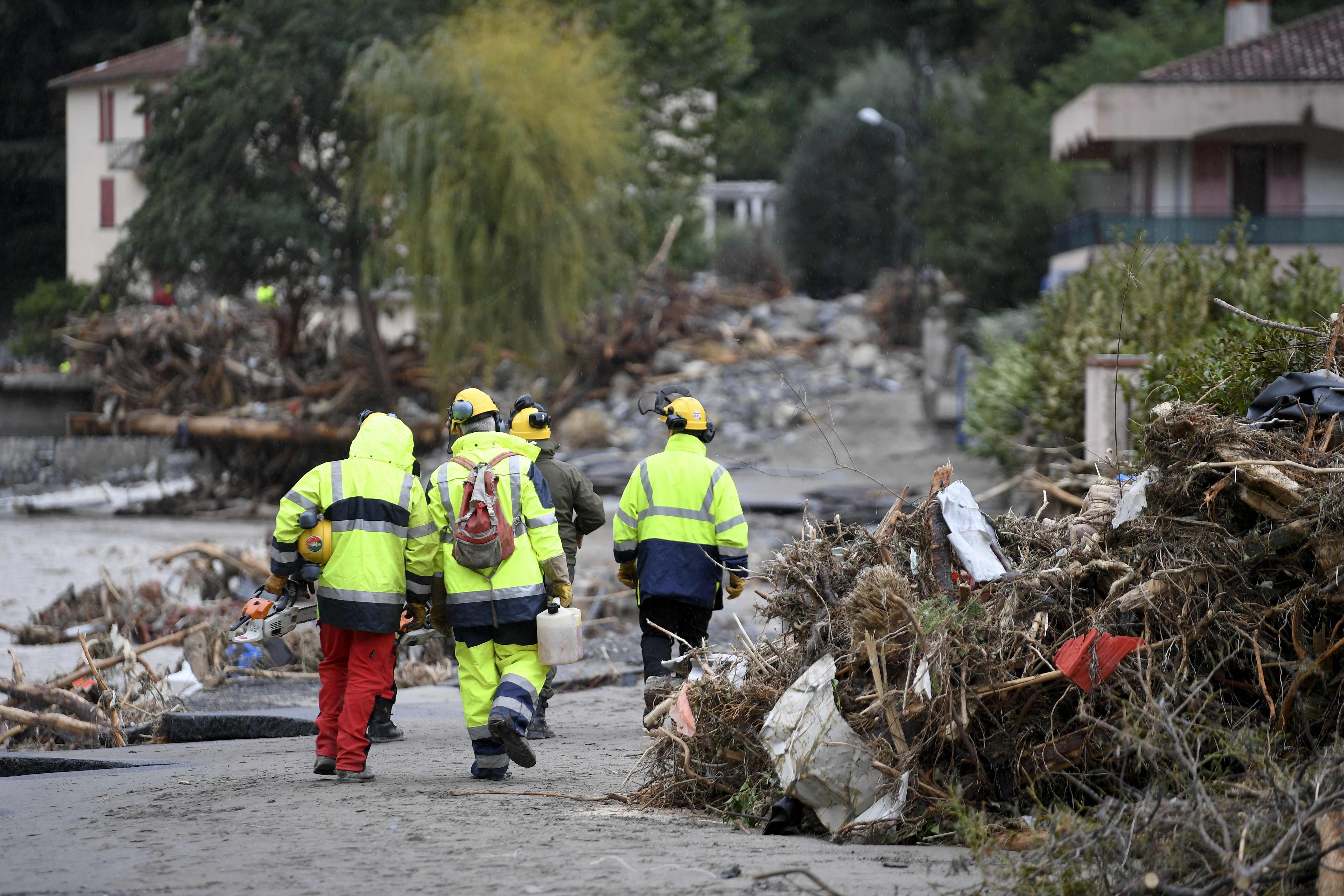 Emergency personnel walk amongst debris on a street in Breil-sur-Roya, south-eastern France. Credits: AFP Photo