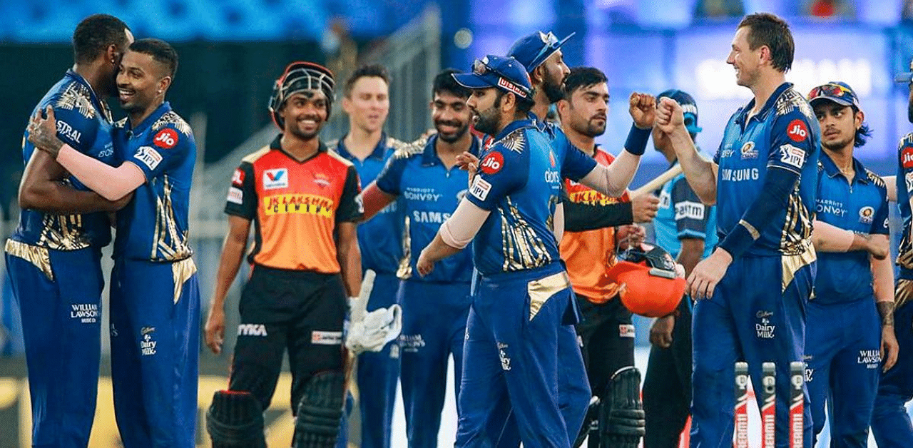  Mumbai Indians players celebrate after defeating Sunrisers Hyderabad during IPL 2020 cricket match, at Sharjah Cricket Stadium in Sharjah, United Arab Emirates. Credit: PTI Photo