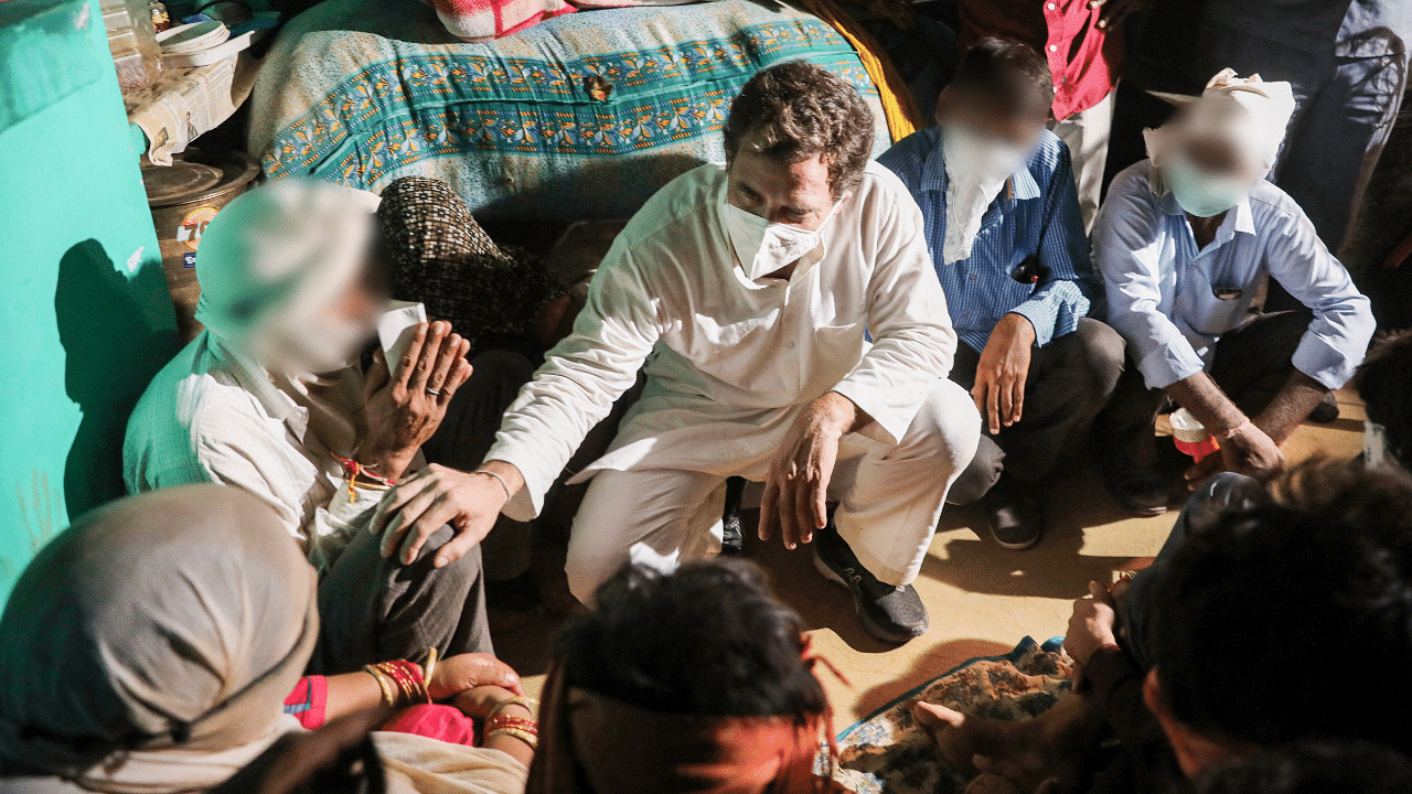 Congress leader Rahul Gandhi meets the family members of a 19-year-old Dalit woman who died after being allegedly raped two weeks ago, at Bulgadi village in Hathras. Credits: PTI Photo