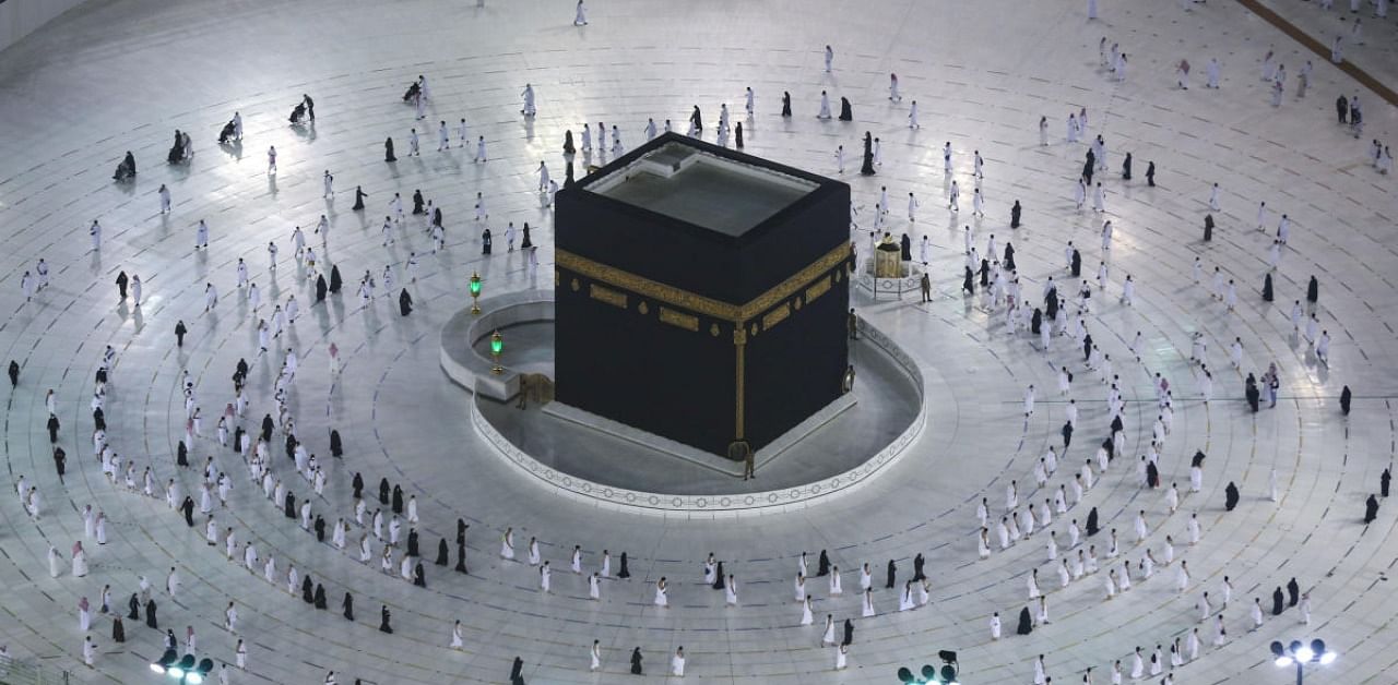 Saudis and foreign residents circumambulate (Tawaf) the Kaaba in the Grand Mosque complex in the holy city of Mecca, on October 4, 2020, as authorities partially resume the year-round Umrah for a limited number of pilgrims amid extensive health precautions after a seven-month coronavirus hiatus. Credit: AFP