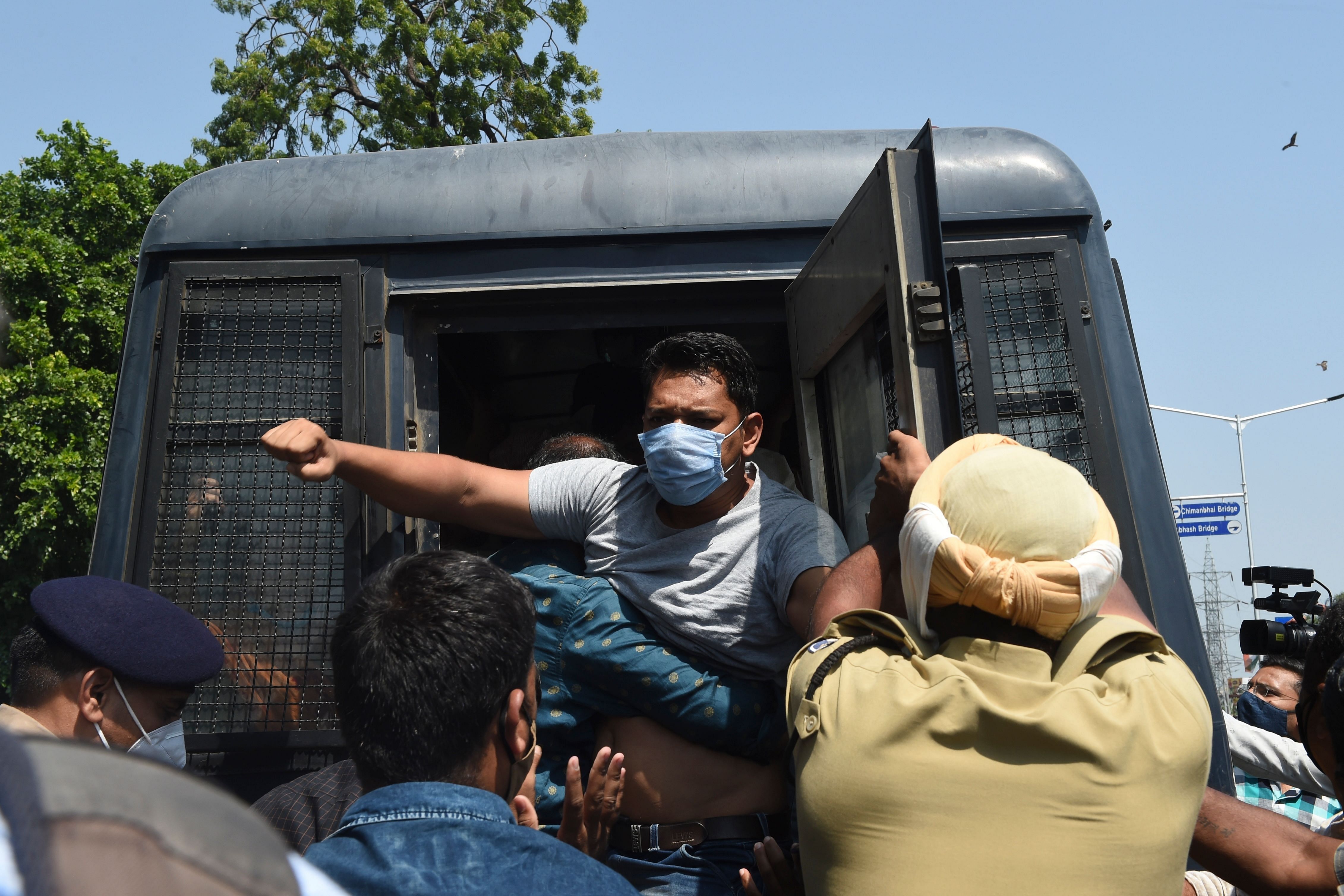 Police detain a Congress party supporter during a demonstration to condemn the alleged gang-rape and murder of a 19-year-old woman in Bool Garhi village of Uttar Pradesh. Credits: AFP Photo