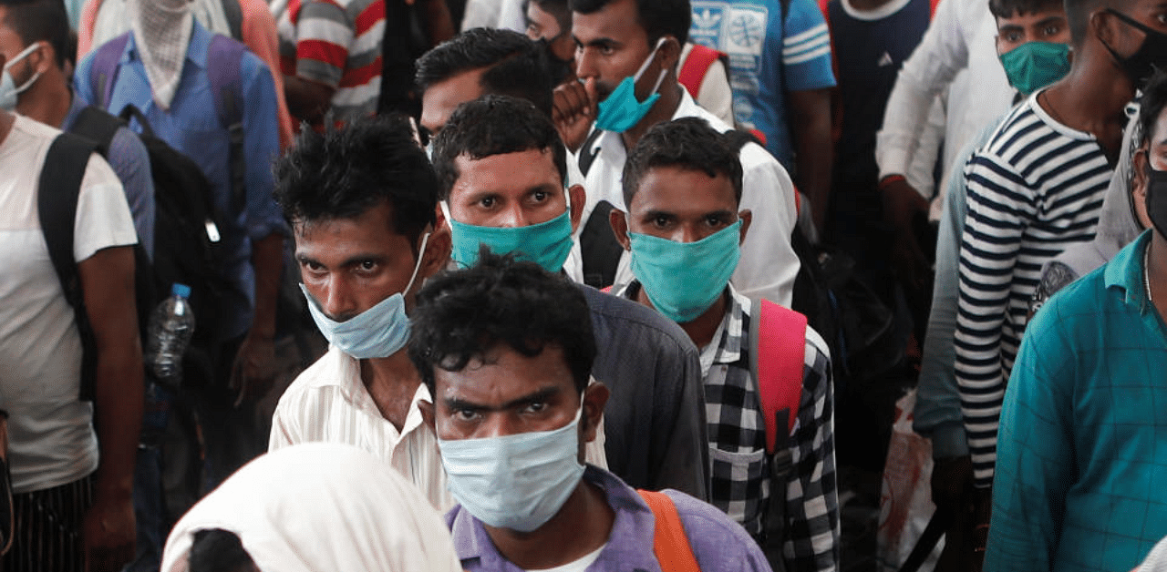 Migrants who returned from their hometown wait in line to be tested for the coronavirus disease (COVID-19) during a rapid antigen testing campaign at a railway station on the outskirts of Mumbai, India, October, 3, 2020. Credit: Reuters Photo