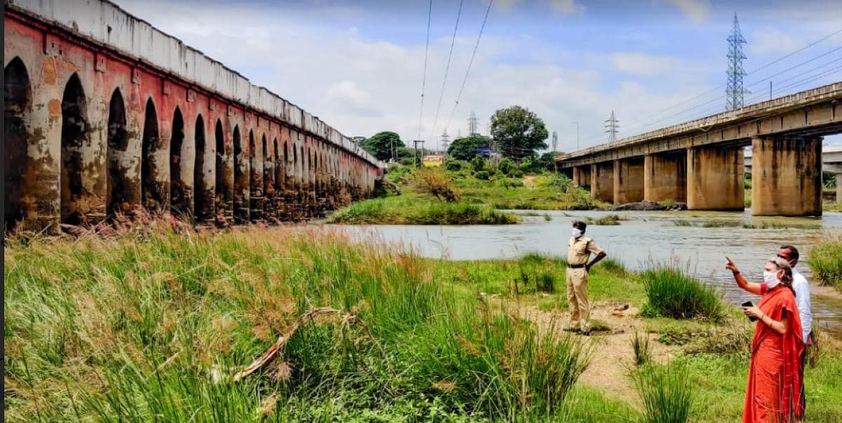 Aparna Garg, divisional railway manager, inspects the Kabini rail-cum-road bridge across River Kapila near Nanjangud in Mysuru district.