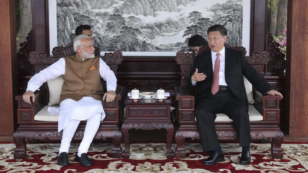 PM Narendra Modi with Chinese President Xi Jinping in Wuhan. Credit: AP/PTI file photo.
