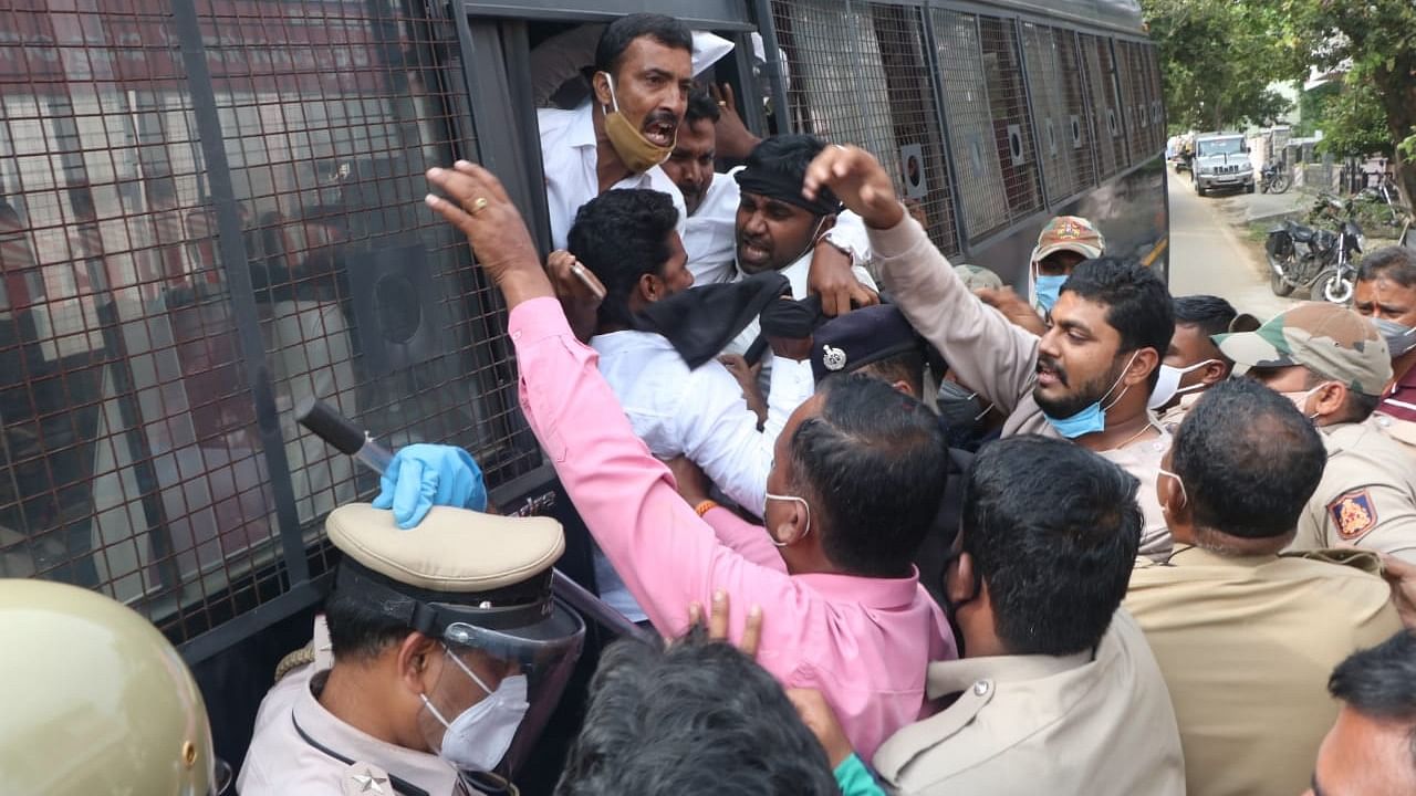 NSUI activists being arrested by police in Shivamogga on Monday. Credit: DH photo.