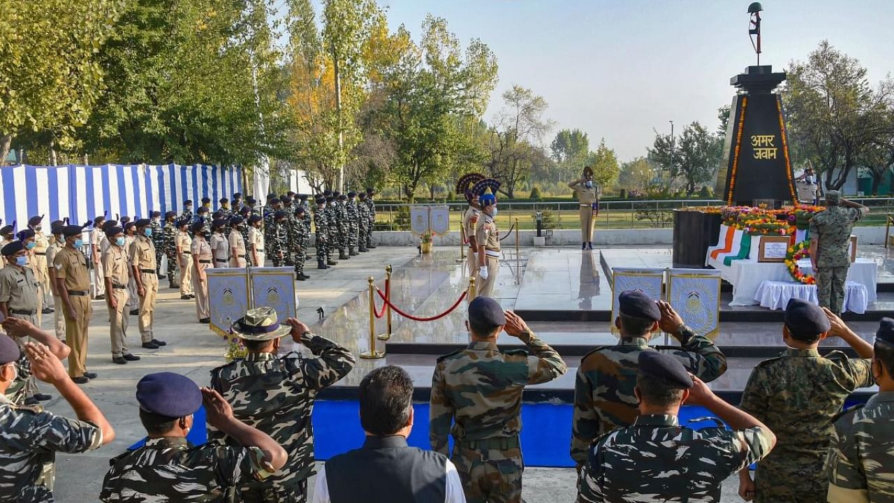 CRPF personnel pay tribute to their two colleagues, who were killed in a militant attack at Pampore yesterday, during a wreath laying ceremony at Humahama on the outskirts of Srinagar. Credit: PTI.
