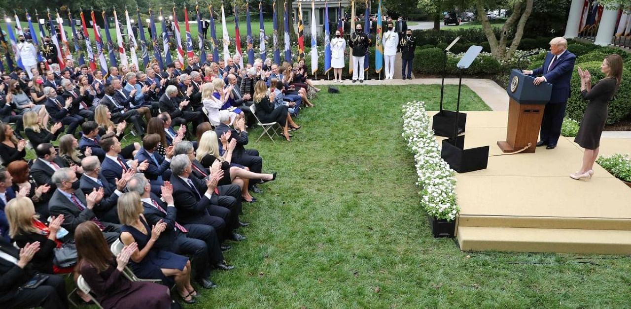 US President Donald Trump announces 7th U.S. Circuit Court Judge Amy Coney Barrett (R) as his nominee to the Supreme Court in the Rose Garden at the White House in Washington, DC. Credit: AFP