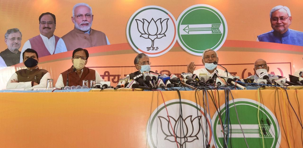 Janta Dal United National President and Bihar Chief Minister Nitish Kumar with BJP senior leader and Dy CM Sushil Kumar Modi addresses a press conference of National Democratic Alliance (NDA) ahead of Bihar Assembly election. Credit: PTI Photo