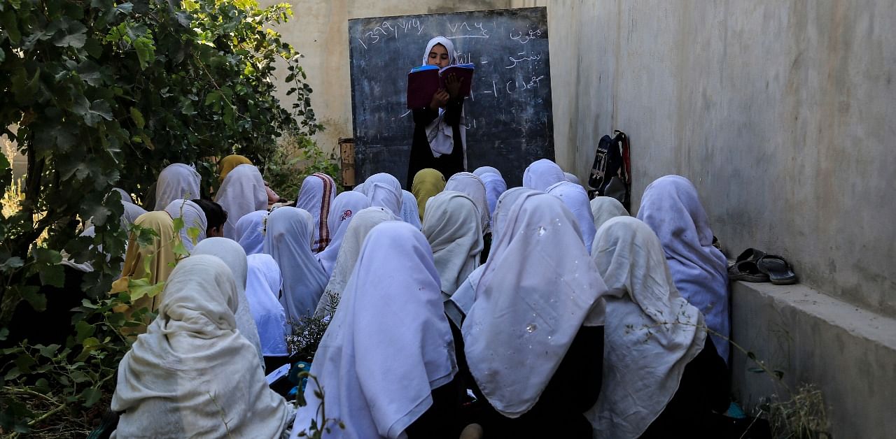 Afghan students attend an open air class at a primary school in Kabul, Afghanistan. Credit: AP Photo