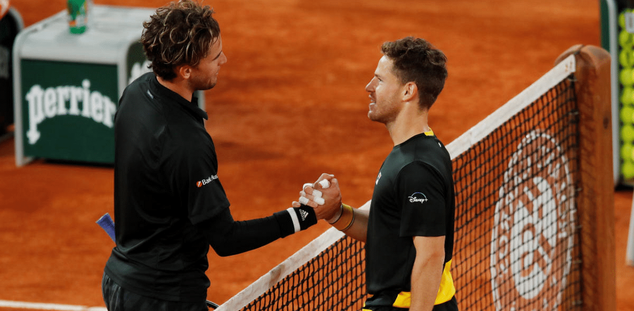 Argentina's Diego Schwartzman with Austria's Dominic Thiem after winning their quarter final match. Credit: AFP Photo