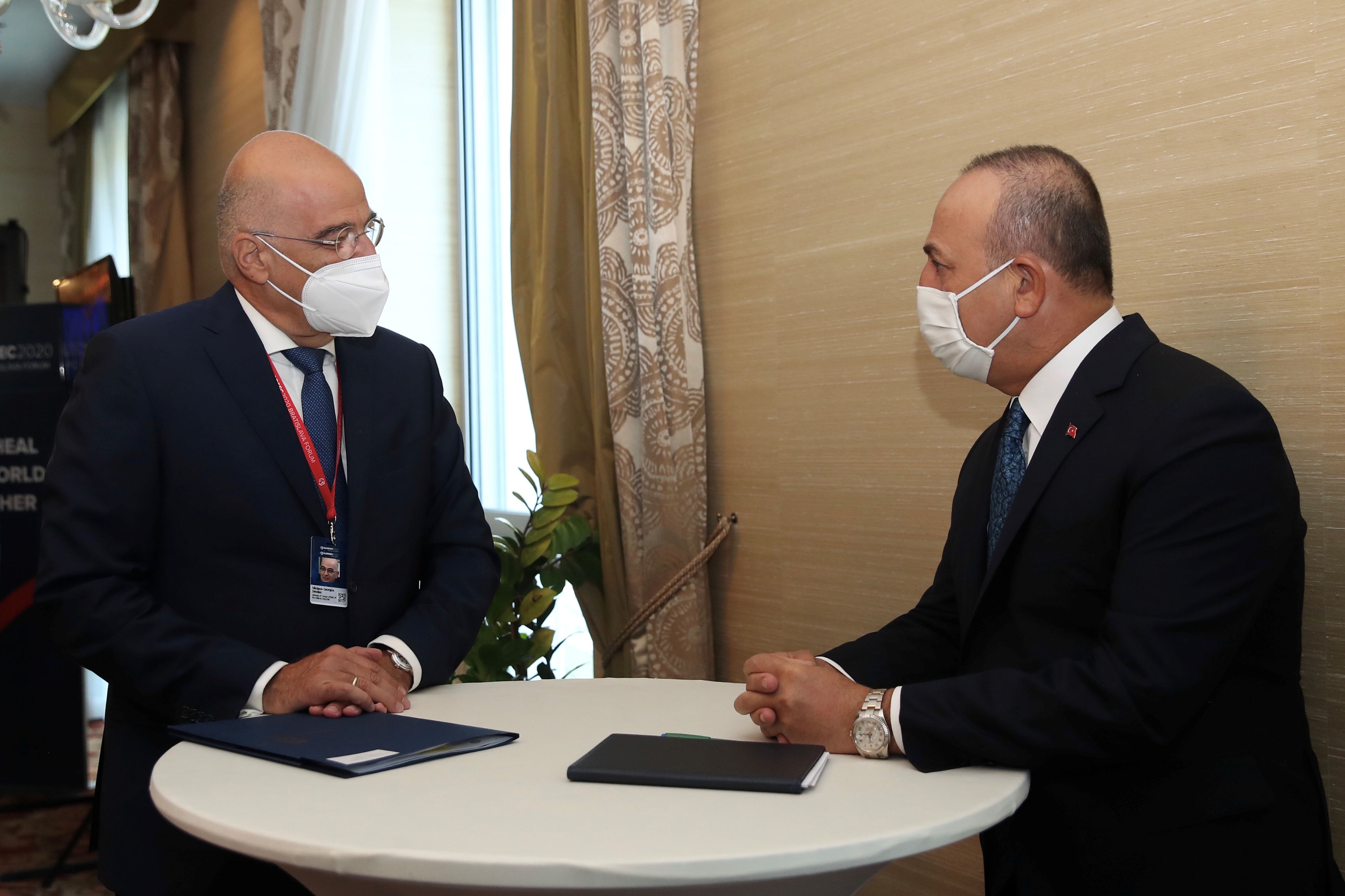 Turkish Foreign Minister Mevlut Cavusoglu meets with his Greek counterpart Nikos Dendias on the sidelines of the Global Security Forum in Bratislava, Slovakia October 8, 2020. Credit: Turkish Foreign Ministry/Handout via REUTERS