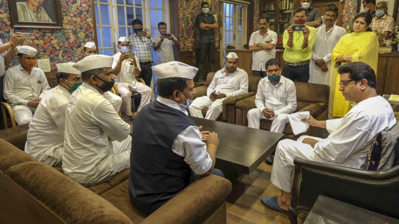 Mumbai Dabbawala Association members meet MNS chief Raj Thackeray over various issues, at Dadar in Mumbai. Credit: PTI/file photo.