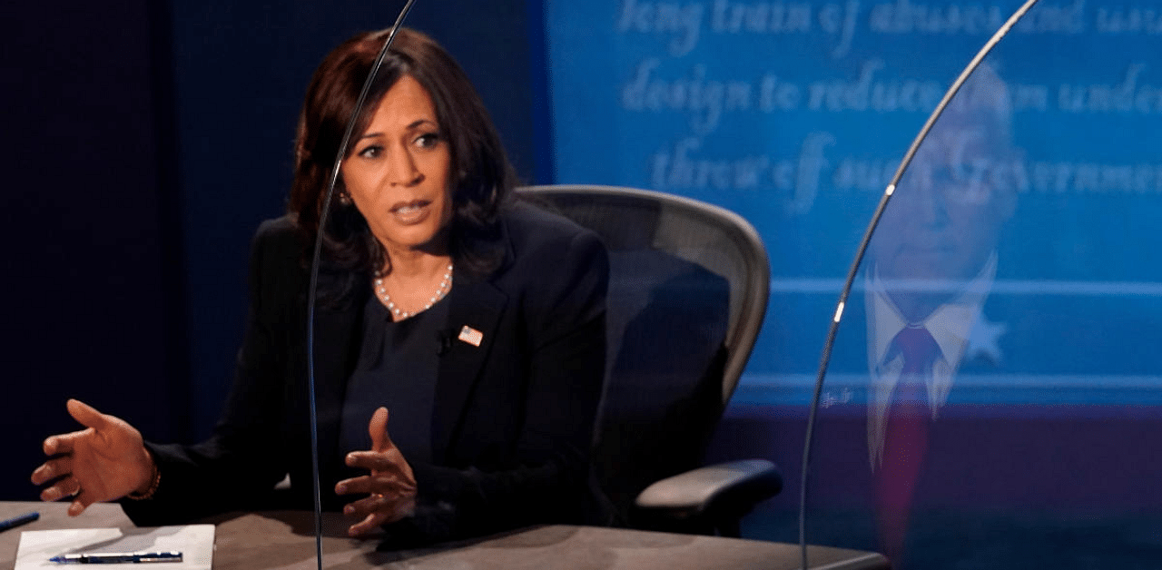 Democratic vice presidential nominee and US Senator Kamala Harris speaks during the 2020 vice presidential debate with U.S. Vice President Mike Pence (reflected on plexiglass barrier on right), on the campus of the University of Utah in Salt Lake City, Utah, US. Credit: Reuters Photo