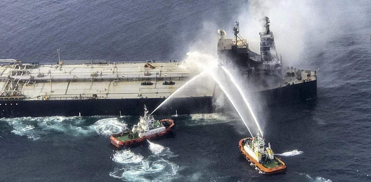 Sri Lanka's Air Force shows fireboats battling to extinguish a fire on the Panamanian-registered crude oil tanker New Diamond, some 60 kms off Sri Lanka's eastern coast where a fire was reported inside the engine room. Credit: AFP