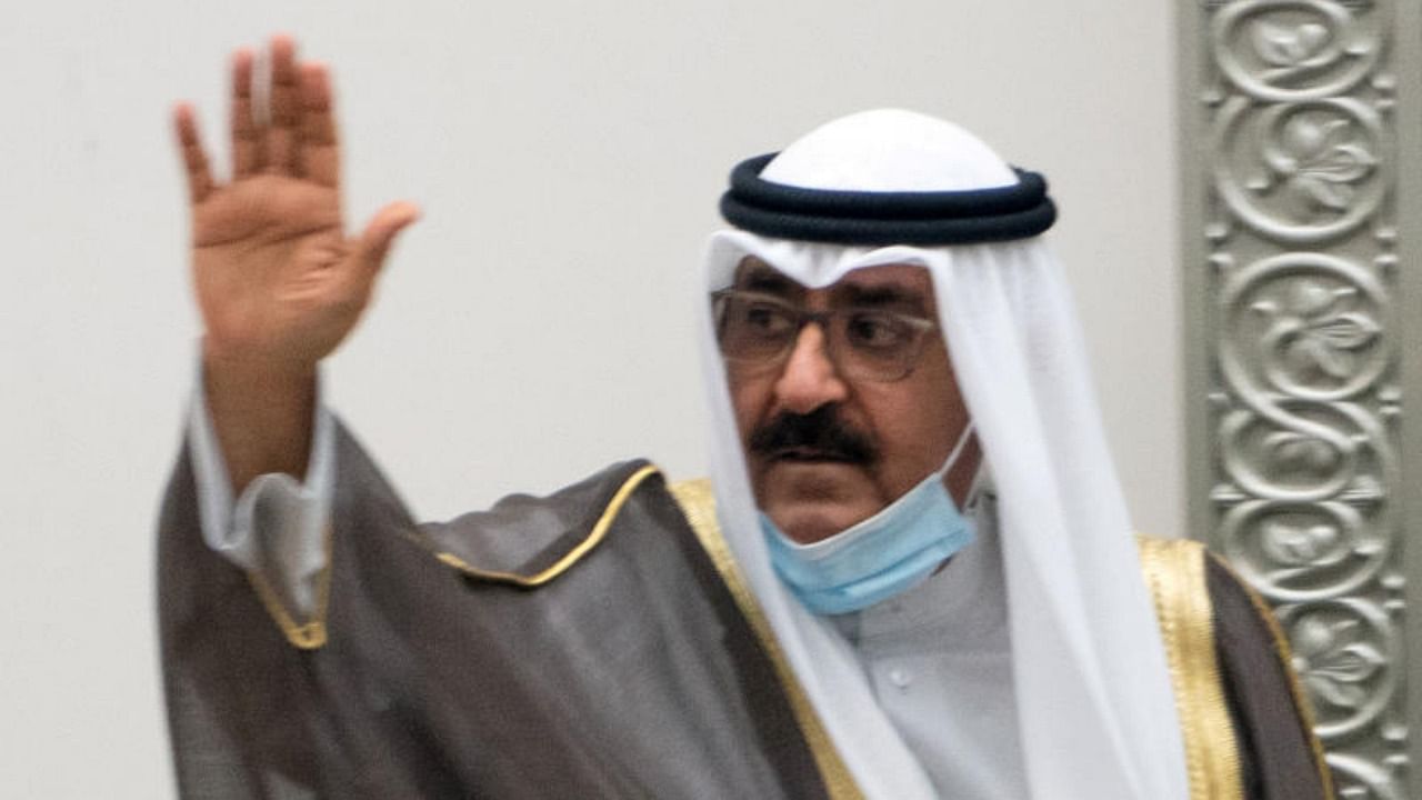 Kuwait's newly appointed crown prince Sheikh Meshal al-Ahmad Al-Jaber al-Sabah waves before he is sworn in, at the parliament, in Kuwait City. Credit: Reuters.