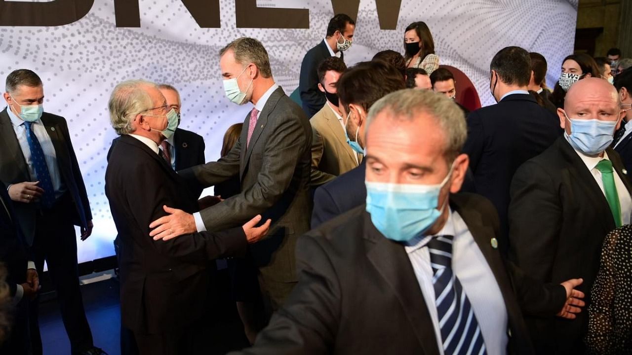 Attendees talk with King Felipe VI of Spain during the the first edition of the Barcelona New Economy Week (BNEW) at the Estacio de Franca (France railway station) in Barcelona. Credit: AFP.