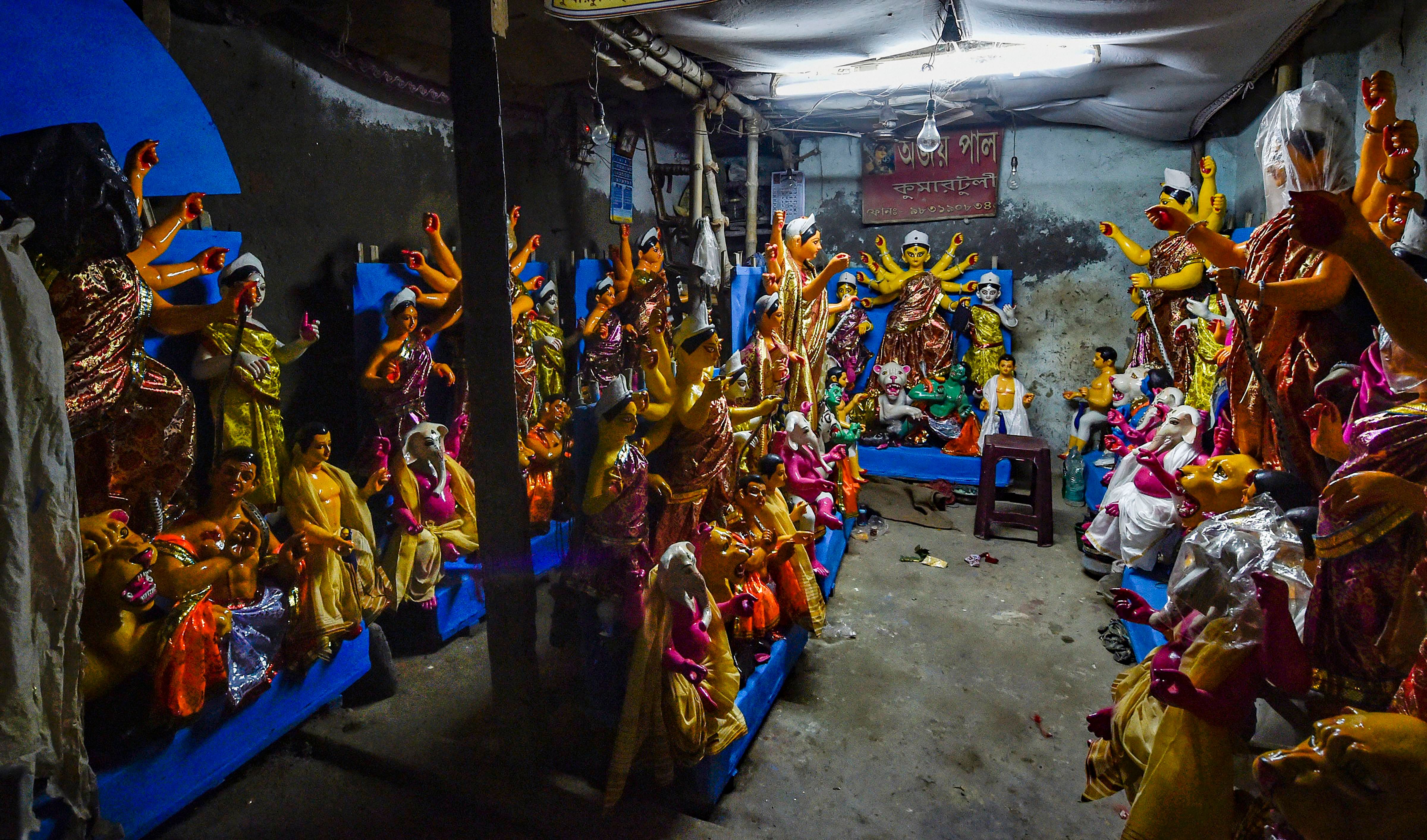 Idols of Goddess Durga for the upcoming Durga Puja festival, at Kumartuli in Kolkata, Sunday, Oct. 4, 2020. Credit: PTI Photo