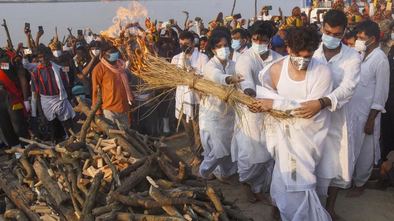 Chirag Paswan, son of Union Minister and Lok Janshakti Party (LJP) leader late Ram Vilas Paswan, lights the funeral pyre containing the mortal remains of his father during the cremation ceremony, at Digha Ghat in Patna. Credit: PTI.
