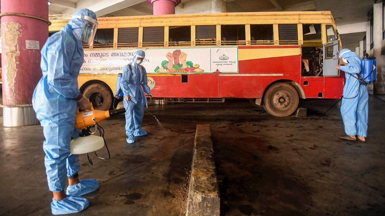 Health workers sanitise KSRTC Bus Stand, during Unlock 5, amid the coronavirus pandemic, in Kozhikode. Credit: PTI.