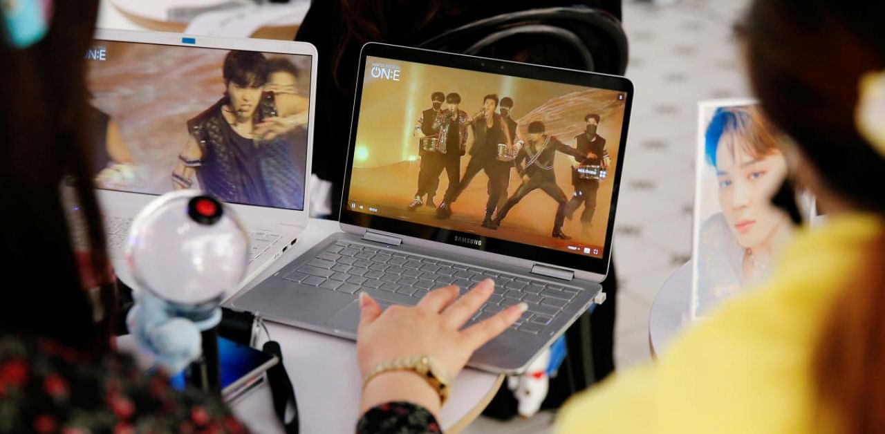 K-Pop fans enjoy BTS's online concert. Credit: Reuters Photo