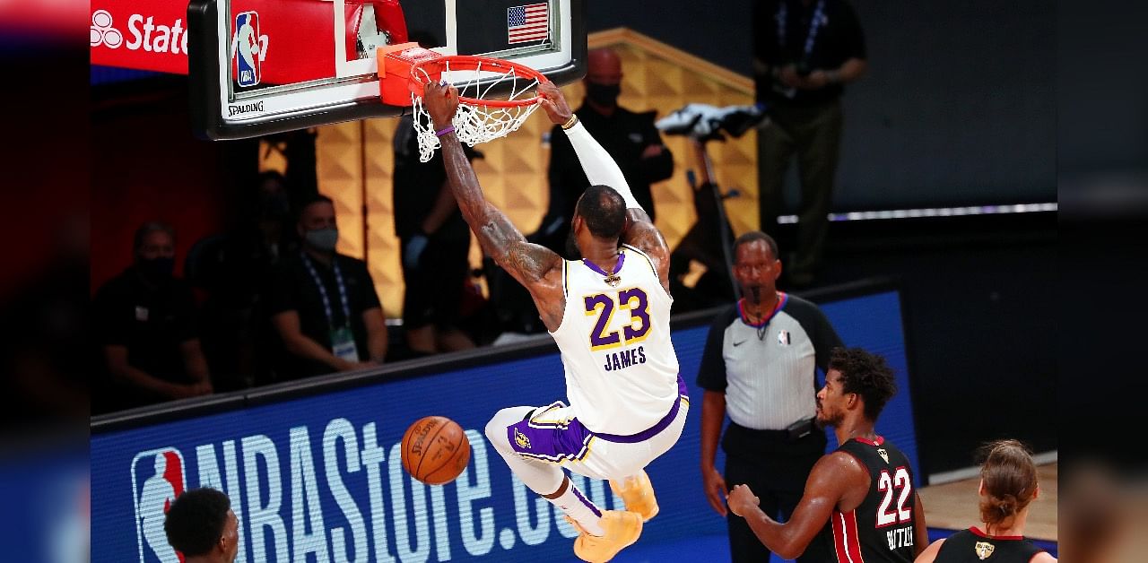 Los Angeles Lakers forward LeBron James (23) dunks against the Miami Heat during the fourth quarter in game six of the 2020 NBA Finals at AdventHealth Arena. The Los Angeles Lakers won 106-93 to win the series.  Credit: USA Today/ Reuters