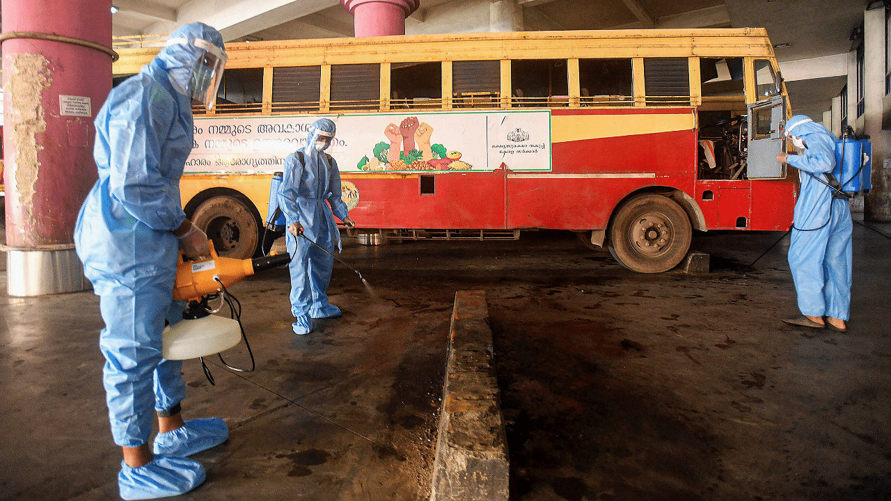 Health workers sanitize KSRTC Bus Stand, during Unlock 5, amid the coronavirus. Credits: PTI Photo