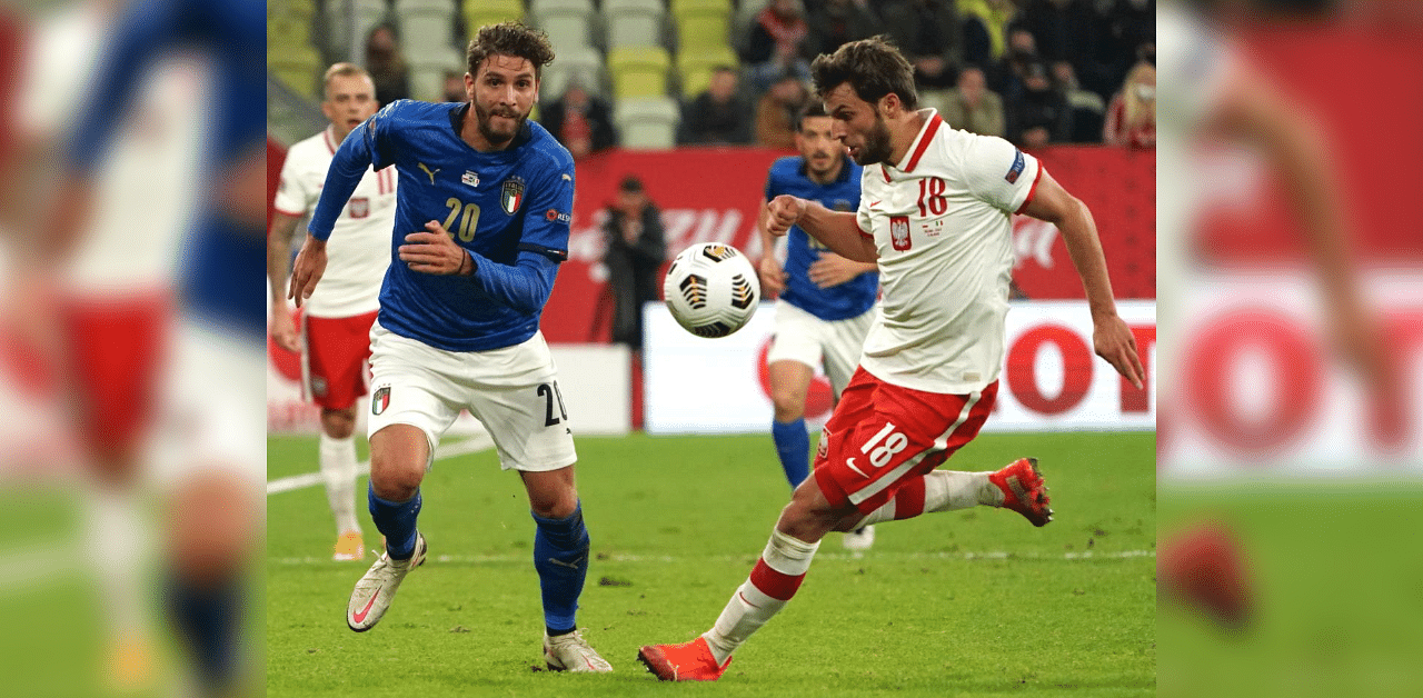 Italy's midfielder Manuele Locatelli and Poland's defender Bartosz Bereszynski vie for the ball during the UEFA Nations League football match Poland v Italy, on October 11, 2020 in Gdansk, Poland. Credit: AFP Photo