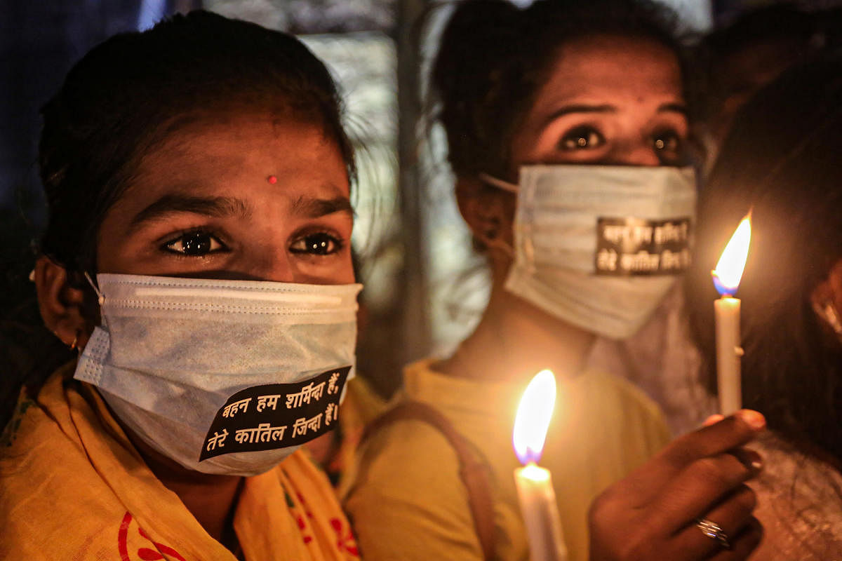Bhopal: Activists light candles during a protest against the death of a 19-year-old Dalit woman who was allegedly gang-raped in UP's Hathras, in Bhopal, Saturday, Oct. 3, 2020. (PTI Photo)(PTI03-10-2020_000264B)