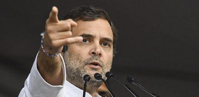 Rahul accused Modi of favouring a handful of corporates by handing out tax cuts to the tune of Rs 1.4 lakh crore, but not finding the money to pay state governments. Credit: PTI File Photo