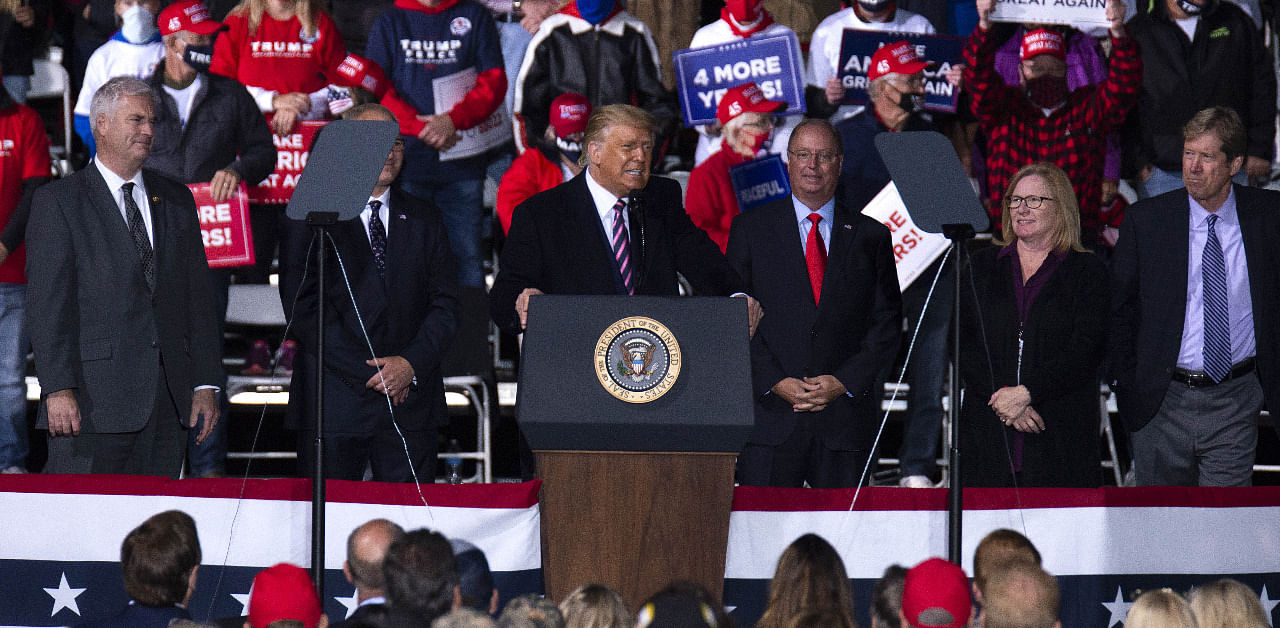 President Donald Trump speaks to supporters as he's joined on stage by a group of Minnesota Republicans during a rally at the Bemidji Regional Airport. Credit: AFP Photo