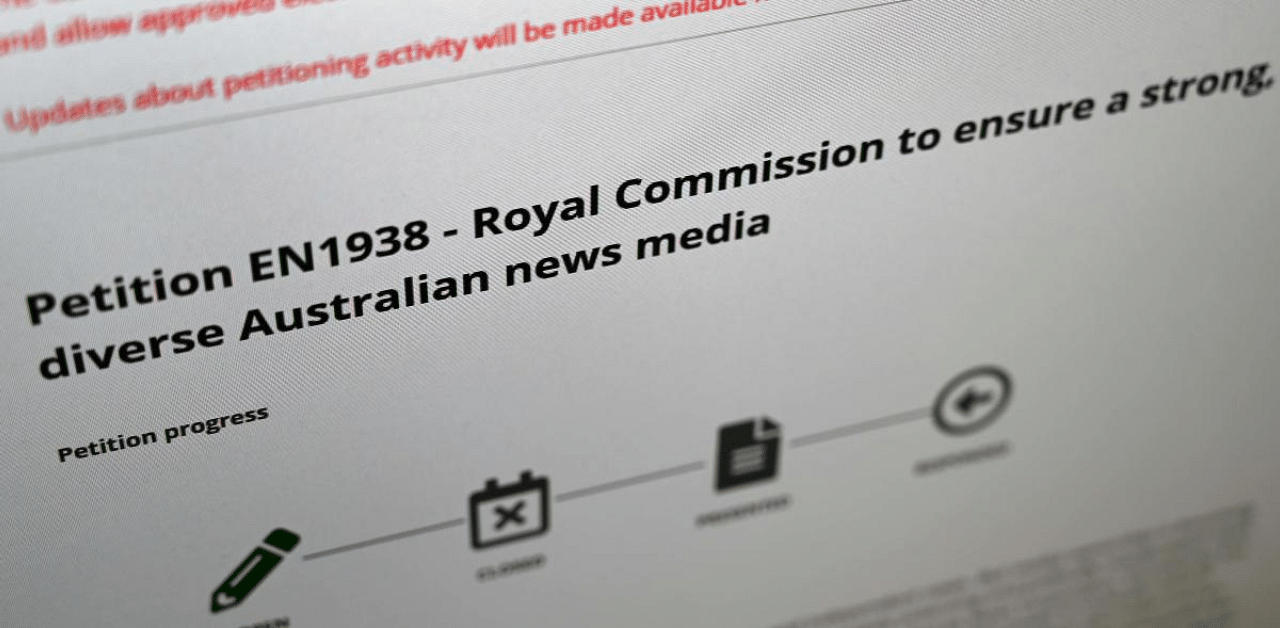 A photo illustration taken in Melbourne shows an online petition launched by former prime minister Kevin Rudd calling for an inquiry into Rupert Murdoch's dominance over Australian media. Credit: AFP Photo