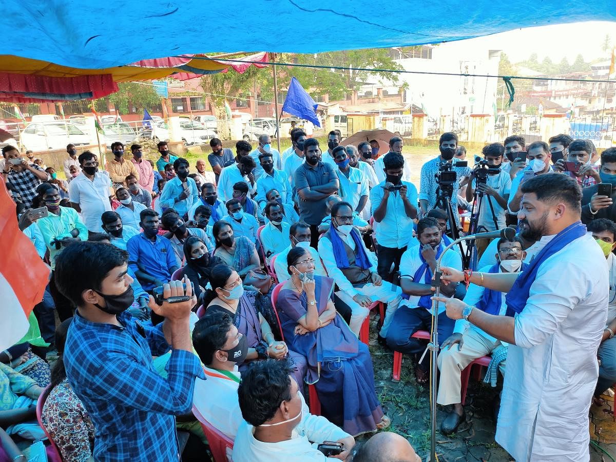 District Youth Congress President Mithun Rai addresses the protesters in Puttur.