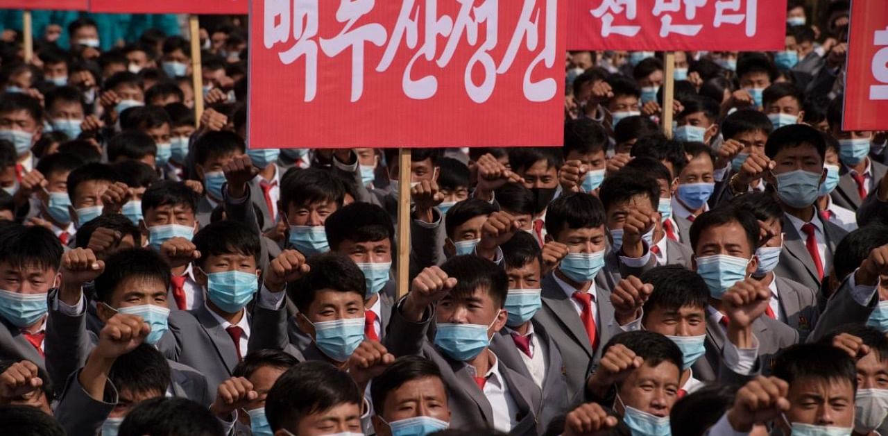 Participants wearing face masks gather during a rally marking the start of an '80-day Campaign' in support of the upcoming 8th Congress of the Workers' Party of Korea (WPK) to be held in January 2021, at Kim Il Sung Square in Pyongyang. Credit: AFP