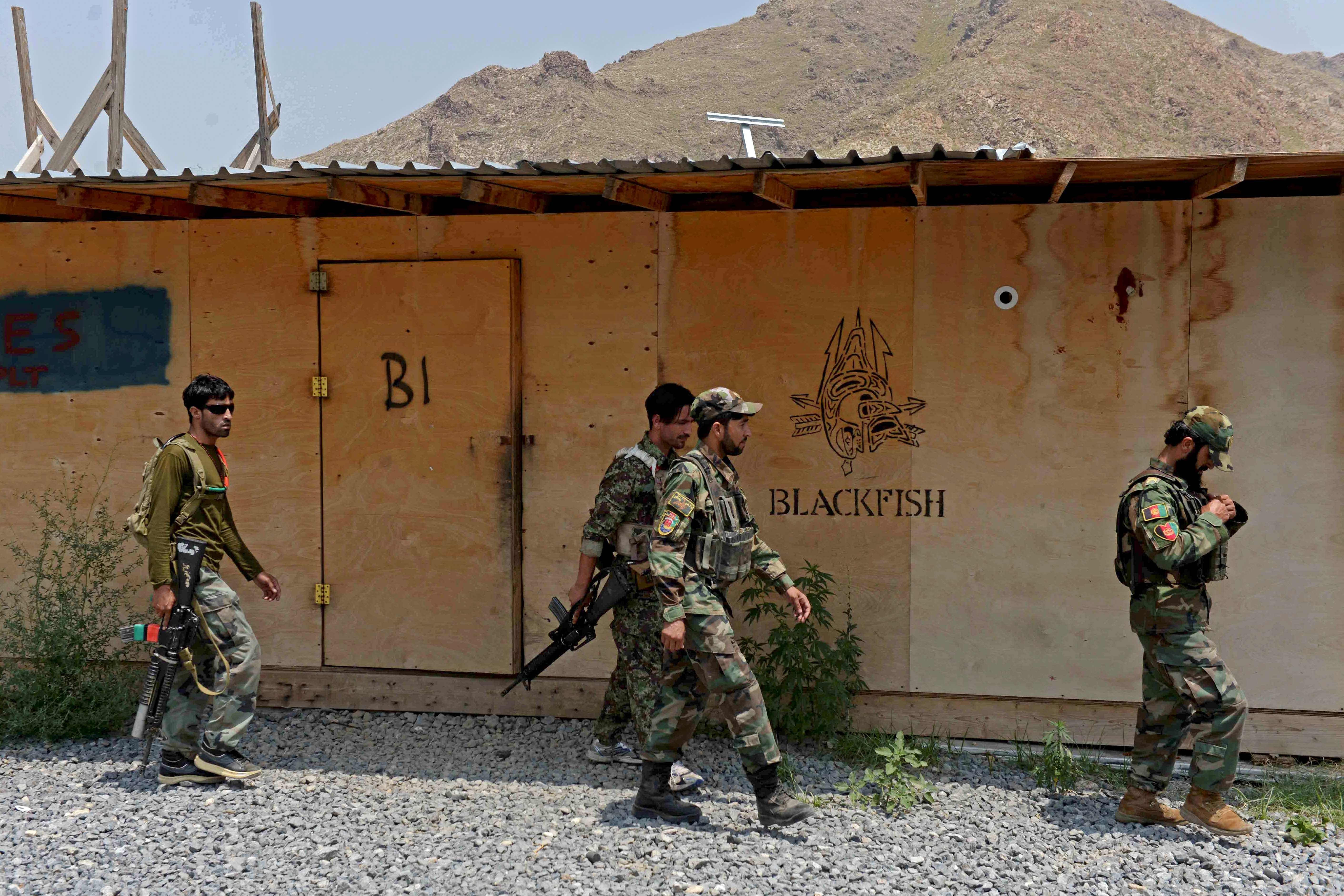 Afghan National Army (ANA) soldiers walk in a US military base, which has been recently handed over to Afghan forces. Credits: AFP Photo