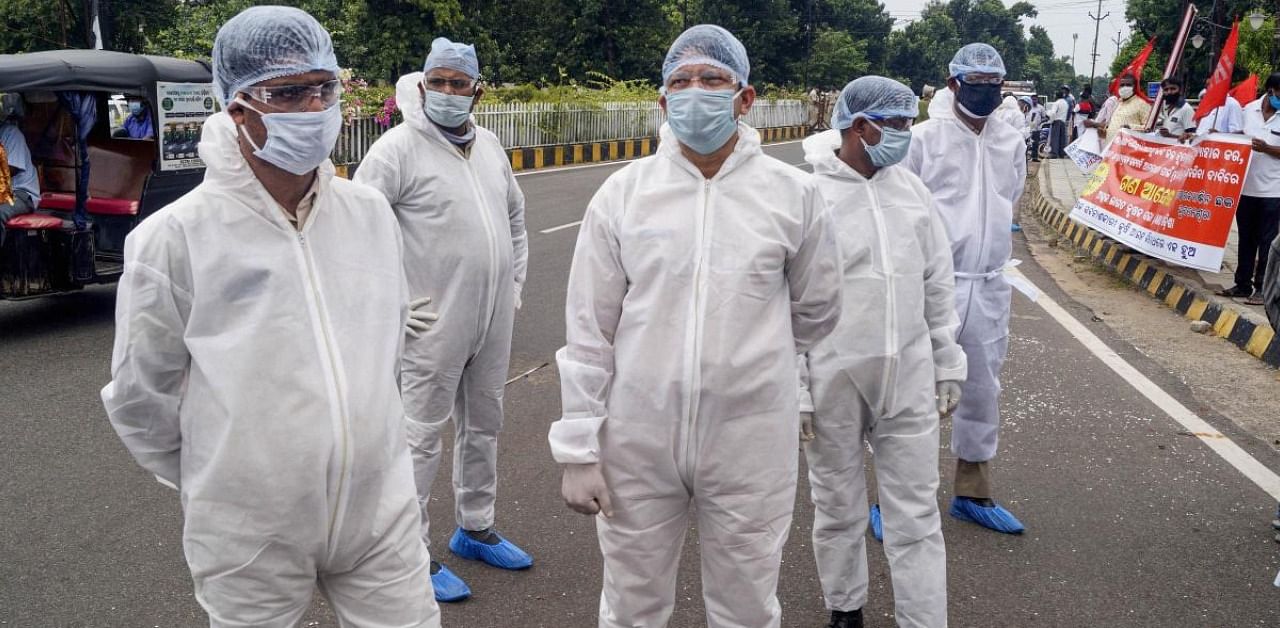 Police personnel wearing PPE kit in Bhubaneswar. Credit: PTI