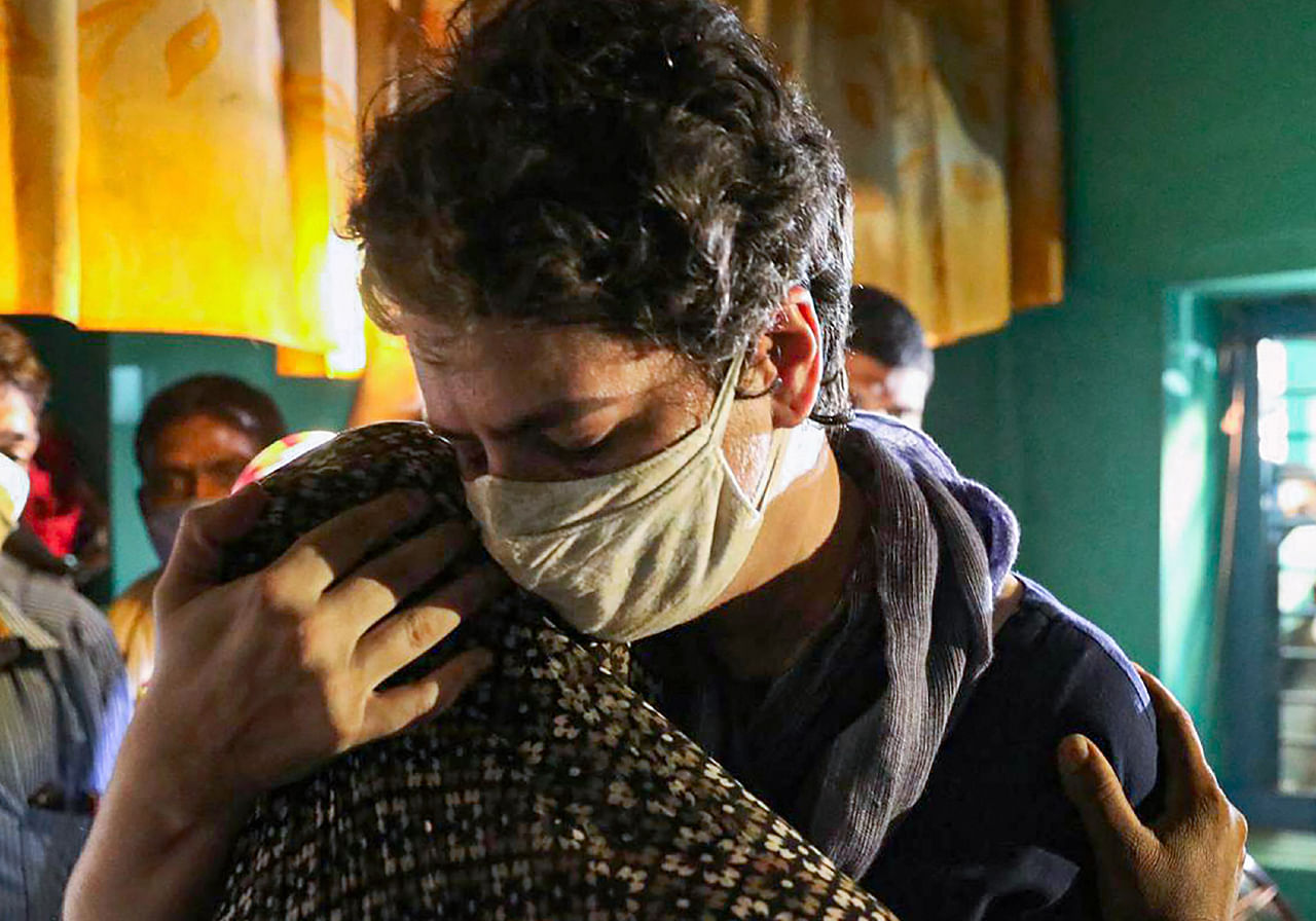 Congress leader Priyanka Gandhi Vadra offers her condolences to the family members of a 19-year-old Dalit woman who died after being allegedly raped two ago, at Bulgadi village in Hathras, Saturday, Oct. 3, 2020. Credit: PTI Photo