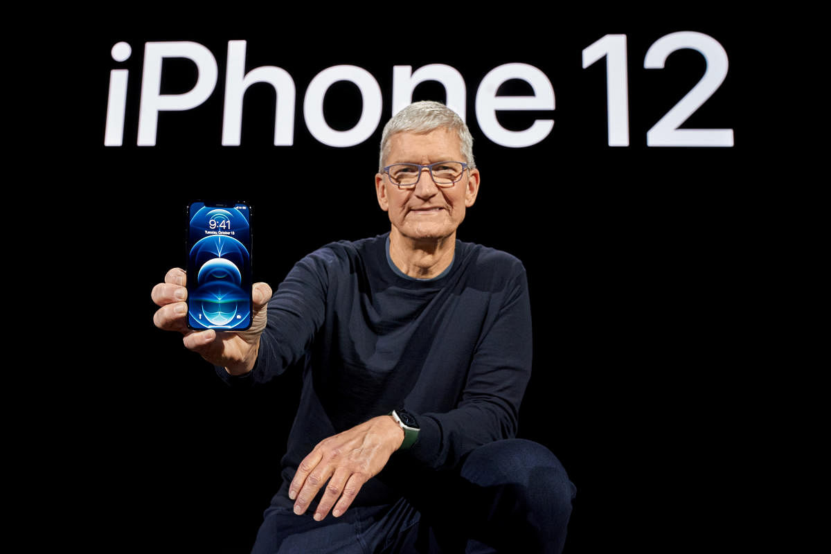 Apple CEO Tim Cook poses with the all-new iPhone 12 Pro at Apple Park in Cupertino, California. Credit: Reuters