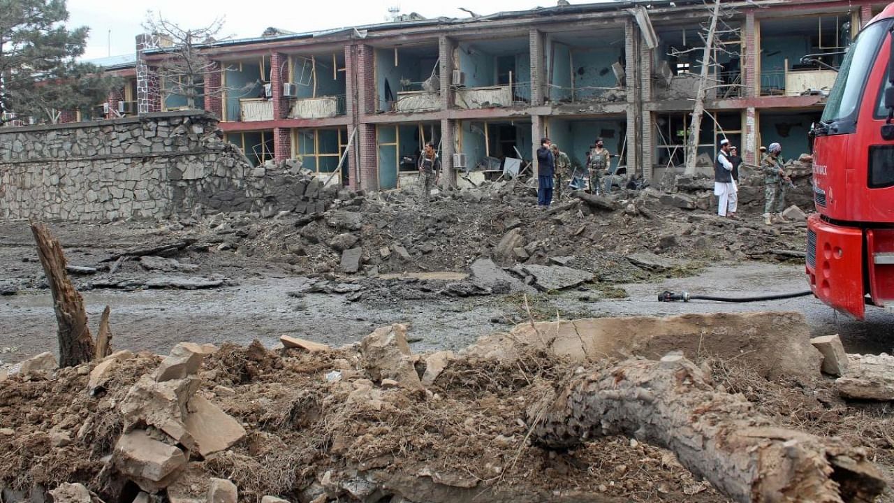 In this file photo Afghan security personnel inspect the site of an attack on Afghan army base in Gardez, capital of Paktia province. Credit: AFP.