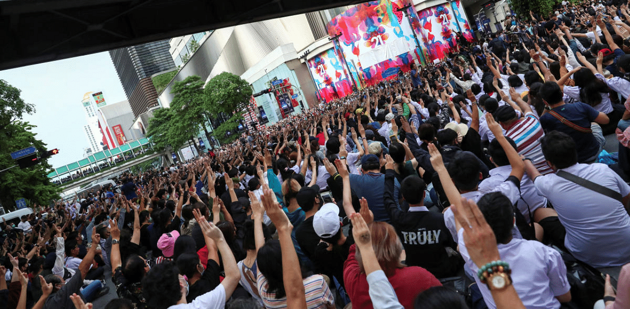 People show the three-finger salute during anti-government protests, in Bangkok, Thailand. Credit: Reuters Photo