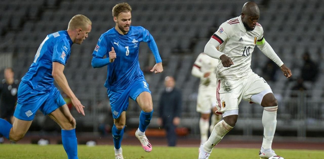 Belgium's midfielder Romelu Lukaku (R) and Iceland's defender Holmar Eyjolfsson vie for the ball during the UEFA Nations League football match Iceland v Berlium in Reykjavik, Iceland. Credit: AFP