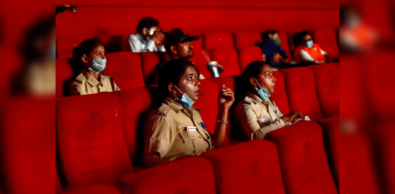 Civil Defence volunteers and other Carona Warriors during special screening of a movie show for them at PVR Cineplex that was reopened as part of Unlock 5, at Naraina in New Delhi, Thursday, Oct 15, 2020.  Credit: PTI Photo